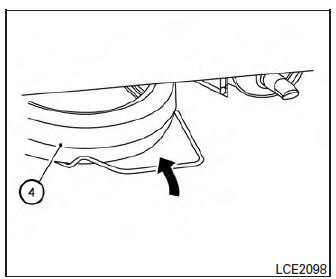 Nissan Micra. Reinstalling the temporary spare tire to its original position